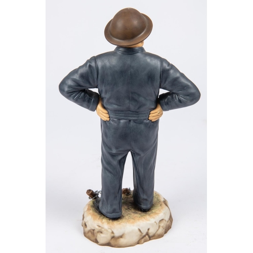 30 - An Ashmore porcelain figure of Sir Winston Churchill, model no 13, standing wearing siren suit, stee... 