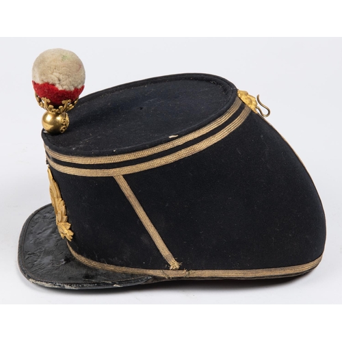 305 - An 1869 pattern officer's shako of the 89th Regiment, blue cloth with gilt lace piping, original bal... 