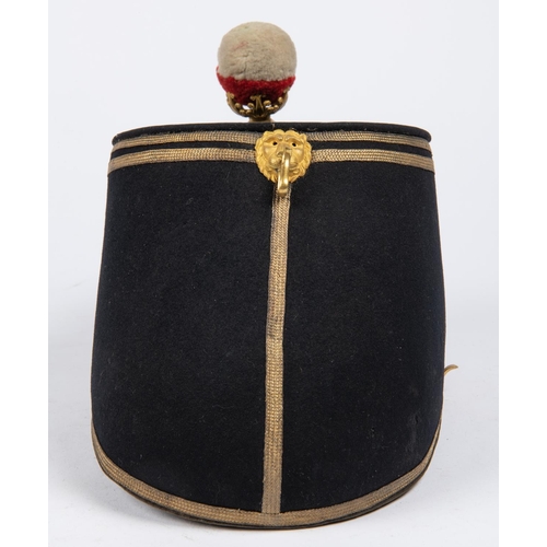 305 - An 1869 pattern officer's shako of the 89th Regiment, blue cloth with gilt lace piping, original bal... 