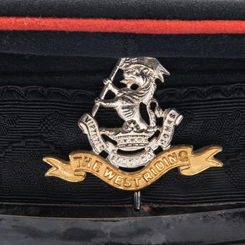 310 - A good West Riding Regt DWO officers' peaked cap, gilt and silver badge, label inside marked 