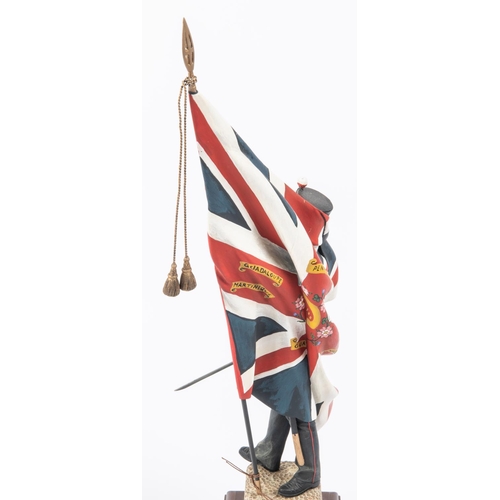 38 - A good Charles Stadden figurine of an infantry officer c 1854 with Regimental Colours, height 13