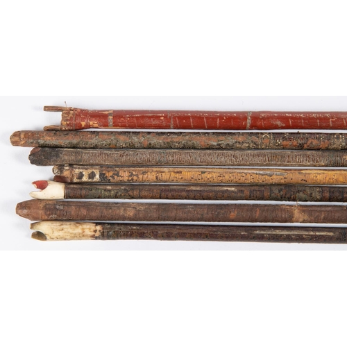 405 - Seven 18th century Indian arrows, with varying flat leaf shaped heads, including two with central ri... 