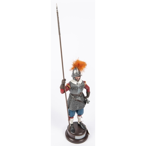 49 - A decorated figure of a Cromwellian pikeman c 1645, with applied armour and weapons, mounted on a po... 