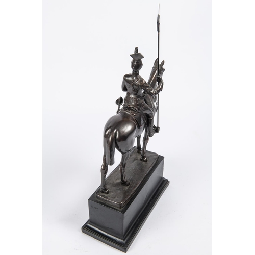 52 - A bronzed composition equestrian figure of a mounted lancer, with lance cap, sword and lance, on rec... 