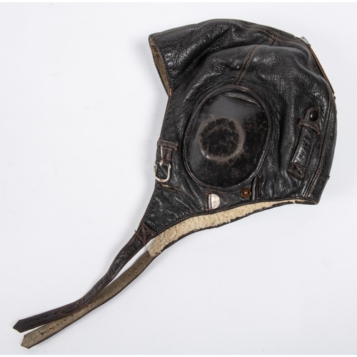 7 - A WWII period leather flying helmet, with rubber ear cups and sheepskin lining. GC Vendor states thi... 