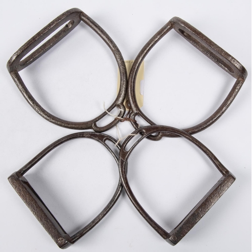 414 - A pair of interesting old (18th-19th century) iron stirrups, of which one arm and the foot plate can... 