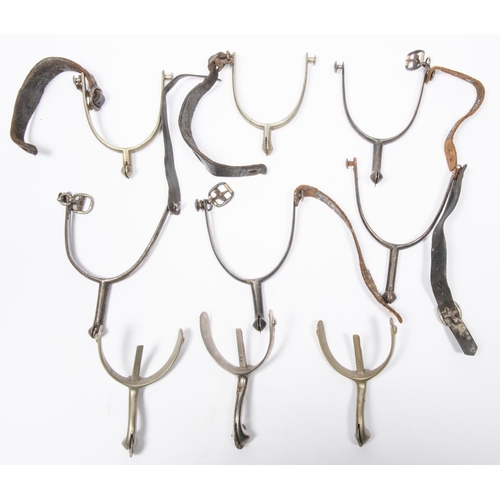 413 - Four pairs of military pattern spurs: pair large steel by Andrews of Oxford, with leather straps and... 