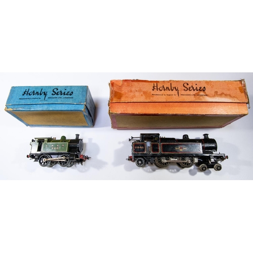 154 - 2x Hornby O gauge clockwork locomotives. A BR No.2 Special 4-4-2T loco, 6948, in lined black. An LNE... 