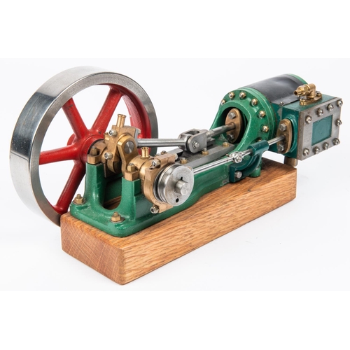 177 - A Stuart single cylinder stationary live steam engine. Horizontal engine with 130mm flywheel. Mounte... 