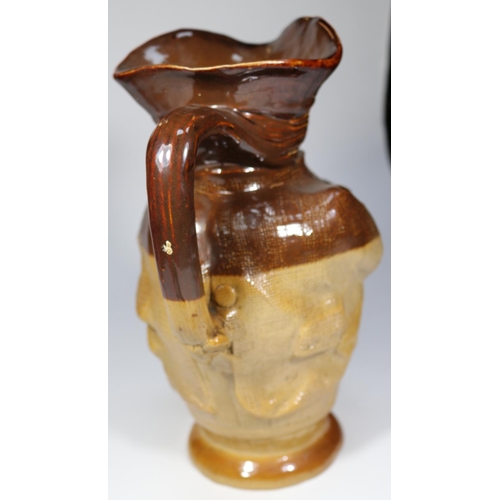 25 - A Doulton Lambeth Toby XX jug (6365). Figure holding jug of ale, sitting on barrel. Issued 1863 onwa... 