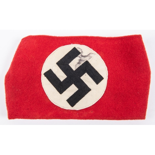 114 - A Third Reich NSDAP arm band with applied swastika motif. GC £200-250