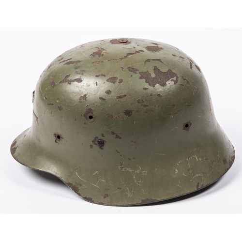 168 - A WWII vintage Spanish Army steel helmet, leather lining, olive drab finish. GC (some chips to finis... 