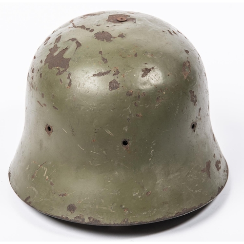 168 - A WWII vintage Spanish Army steel helmet, leather lining, olive drab finish. GC (some chips to finis... 