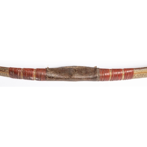 391 - An 18th century Indian composite bow, the main body with remains of cream lacquer with gold and gree... 