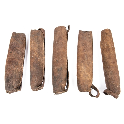 392 - Five small 18th century Indian hide quivers, probably for crossbow bolts, average 9