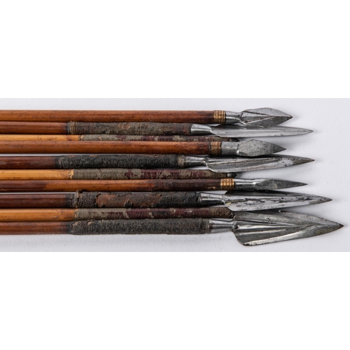 402 - A set of three 18th century Indian arrows, large leaf shaped heads with central rib; another set of ... 