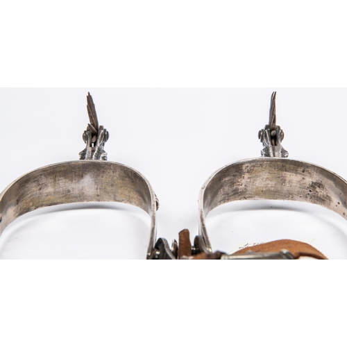 412 - A pair of historically interesting mid 19th century Mexican silver spurs, with deeply embossed folia... 