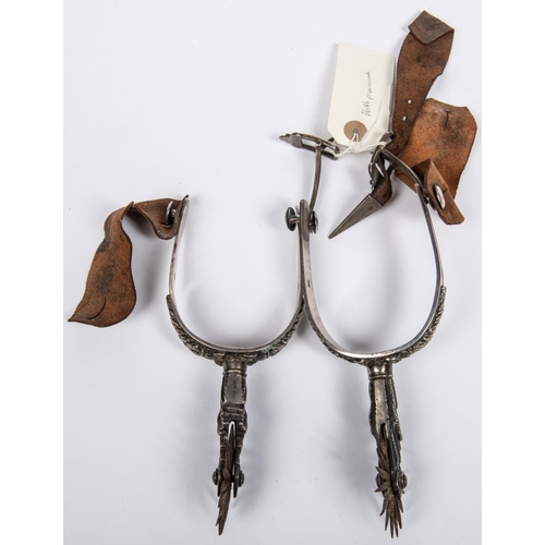 412 - A pair of historically interesting mid 19th century Mexican silver spurs, with deeply embossed folia... 