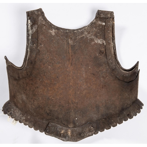 415 - An early 17th century officer’s breastplate, with rolled neck, scalloped borders, separate roped gus... 