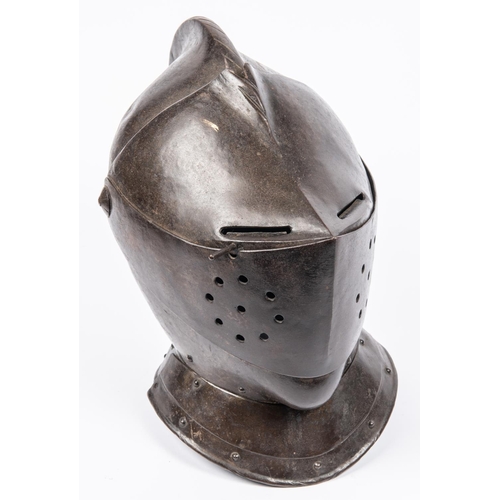 419 - A good old copy of a close helmet, c 1600, of heavy construction, the skull and low comb formed in t... 