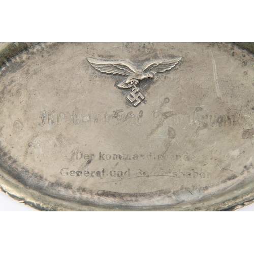 93 - A Third Reich white metal salver, with applied Luftwaffe badge, 9½