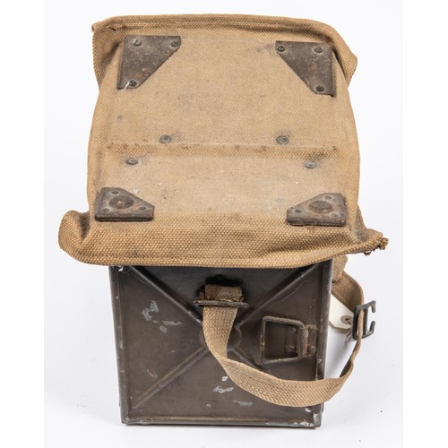 152 - A WWII British Army Electric Morse signalling lamp, in its steel and webbing case complete with 4 pa... 