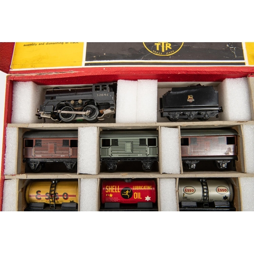 176 - A Trix Twin OO gauge railway freight set. Comprising; BR 0-4-0 tender locomotive, 30846, in black. T... 