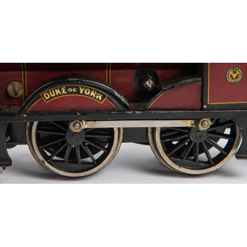 236 - A Bassett Lowke O gauge clockwork Duke of York 4-4-0 tender locomotive. LMS 1927, in lined maroon li... 