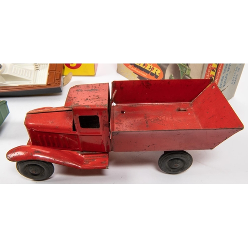 308 - 4 1950's British made items. A Lines Bros heavy duty tinplate tipping truck in red, with black rubbe... 