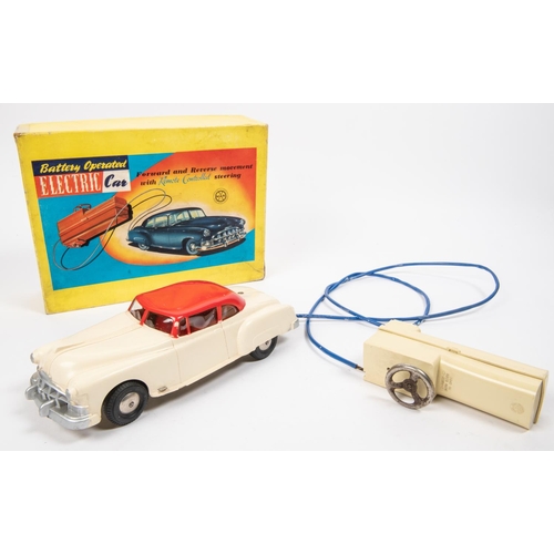 311 - 2 MARX 1950's Toys. A 'Battery Operated Electric car'. In the form of a 1950's American sedan in cre... 