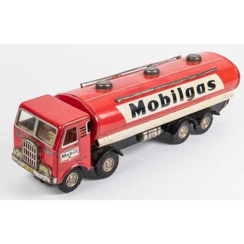 313 - A 1960's Japanese tinplate 8 wheeled Mobilgas tanker by Horikawa. No.159, in  red and white livery, ... 