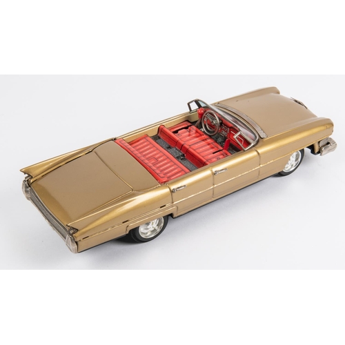 314 - Bandai 1960's Tinplate Cadillac 'Gear Shift car'. (4102). A 4 -door open topped sedan finished in me... 