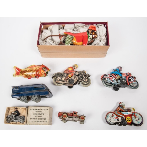 318 - A small quantity of tinplate items. A 'CURT 420' North African style monkey in waistcoat and Fez, co... 