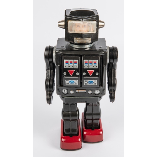 319 - Horikawa Super Astronaut battery powered tinplate Robot. 29cm high, finished in dark metallic grey w... 