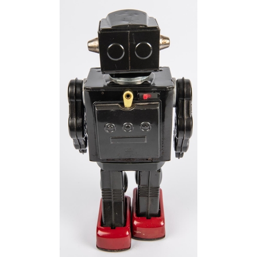 319 - Horikawa Super Astronaut battery powered tinplate Robot. 29cm high, finished in dark metallic grey w... 