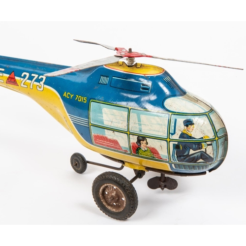 320 - A Technofix tinplate clockwork Helicopter. Clockwork motion powers wheels and rotors. In blue and ye... 