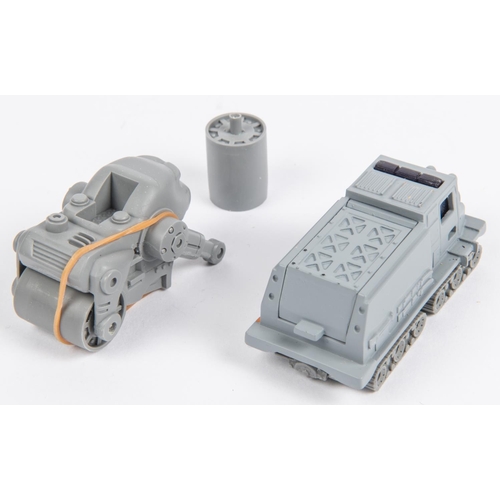 404 - 2 Matchbox American pre-production resin castings. 2000 Sno Cat, with painted grey body over red res... 