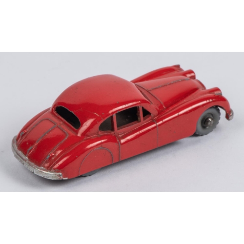 438 - Matchbox Series Jaguar XK140 No.32. An example in bright orange-red with grey plastic knobbly wheels... 