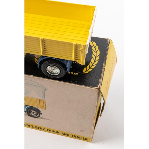 474 - 2 Dinky Toys. A Mercedes-Benz Truck And Trailer (917). An example in dark blue and yellow, cab with ... 