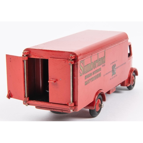 497 - Dinky Supertoys Guy Van (514). In Slumberland red with red wheels, complete with both rear doors. Bo... 