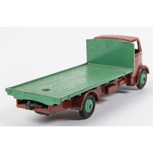 498 - Dinky Supertoys Guy Flat Truck (512). An early example made for 1 year only in 1948. Dark brown cab ... 