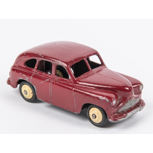 500 - A scarce Dinky Toys Standard Vanguard (40e). An example in maroon with open rear wheel arches, fitte... 