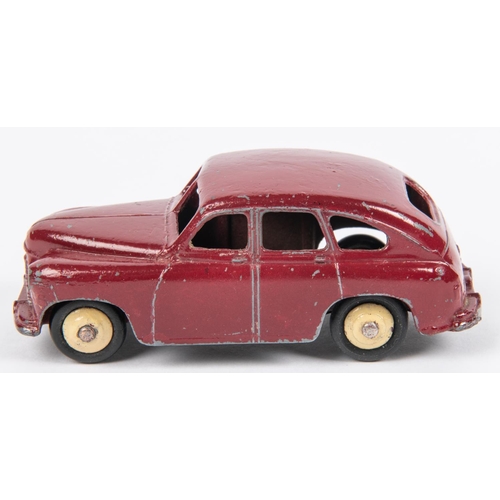 500 - A scarce Dinky Toys Standard Vanguard (40e). An example in maroon with open rear wheel arches, fitte... 