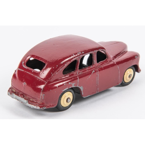 500 - A scarce Dinky Toys Standard Vanguard (40e). An example in maroon with open rear wheel arches, fitte... 