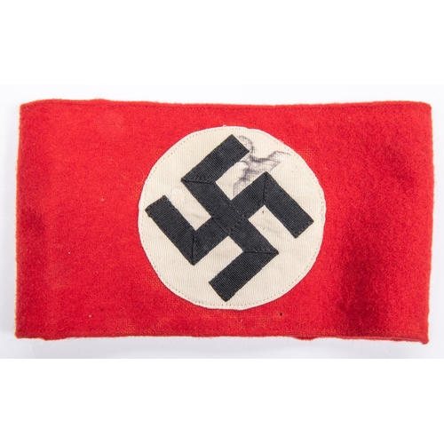 104 - A Third Reich NSDAP arm band with applied swastika motif. GC £150-200