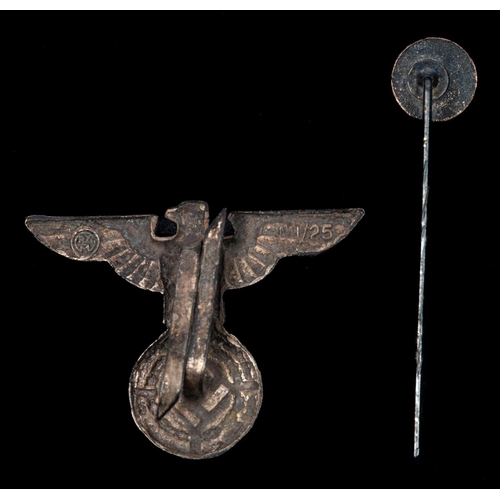 109 - A scarce Third Reich SS cap eagle, and an enamelled SS tie pin. GC £60-80