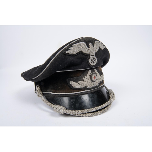 111 - A Third Reich Diplomatic officer's SD cap, alloy embroidered cords and badges, black velvet band, li... 