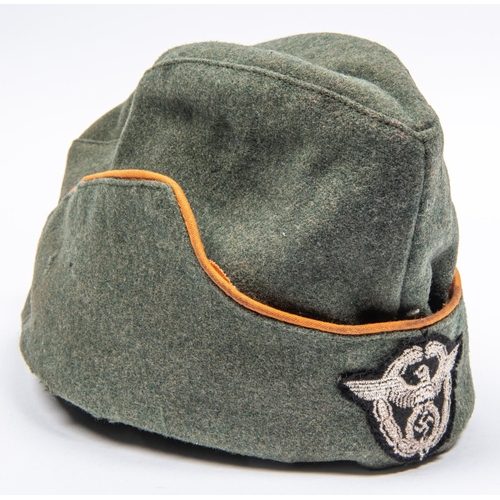 119 - A Third Reich OR's Police FS cap, orange piping, woven wreathed eagle badge. GC (some mothing). £100... 