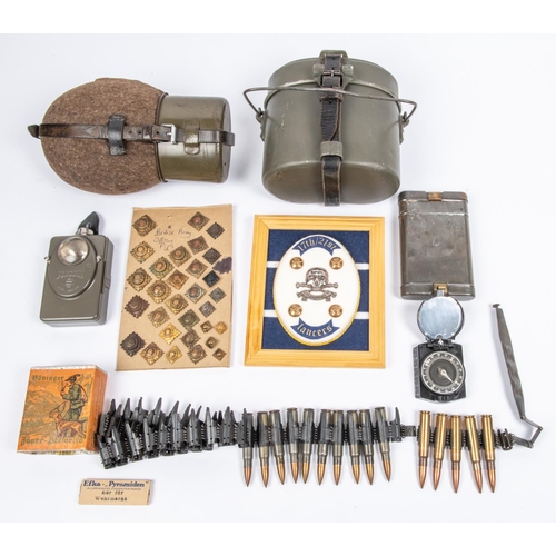 124 - A WWII K98 cleaning kit in steel case; an original unopened German Army packet of 