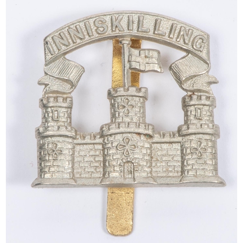 150 - A scarce white metal cap badge of the Inniskilling Fusiliers, c 1926-1934. GC £30-50